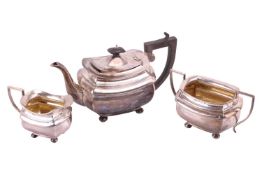 A three-piece silver tea service, Birmingham 1915 by Joseph Gloster Ltd., comprising a teapot, a twi