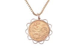 A gold half-sovereign pendant, in a yellow metal mount tested as 14ct gold, on a 9ct yellow gold box