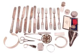 A collection of items including a a silver vesta case, a silver case wick lighter, a Bollinger corks
