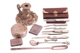A collection of silver and other items, including a silver chamber stick, a silver marrow scoop, a s