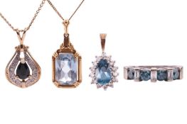 A diamond-set ring, featuring four round brilliant treated blue diamonds set between three baguette 