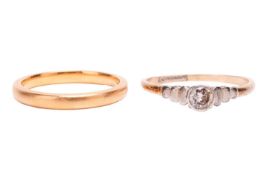 A diamond solitaire ring together with a 22ct gold wedding band; the mixed round-cut diamond is in a