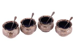 A set of four Victorian silver table salts and associated spoons, London 1879 by Charles Edwards, wi