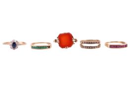 A group lot of rings. Includes a carnelian dress ring, the square cut carnelian is within a four cla