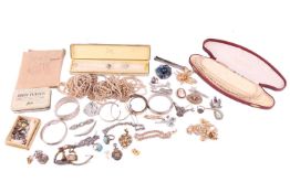 An Art Deco white metal and paste cocktail watch; an Art Deco bow-shaped bar brooch; a white metal a