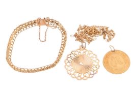 A collection of jewellery items including a panel link bracelet with curb link edges, in yellow meta