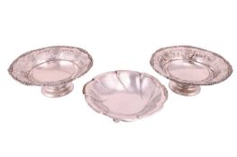 Three Continental bon bon dishes; including a pair of matching pedestal dishes, with flared rims pie