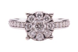 A diamond-set cluster ring, of floral design, the central round brilliant diamond measuring approxim