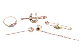 A collection of jewellery items including an emerald and old-cut diamond ring, in a yellow metal