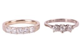 A diamond half hoop ring and a diamond three stone ring; the diamond half hoop ring set with a row o
