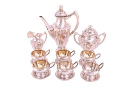 An Art Deco three-piece coffee service with six cups and saucers, circa 1930s; of vase form with flu