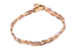 A three-tone bracelet formed of woven yellow, white and rose metal marked 'Italy 750', measuring 18.
