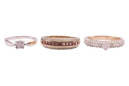 A diamond-set solitaire ring with pavé-set shoulders in a 9ct yellow gold mount, size Q1/2, together