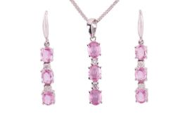 A pink sapphire and diamond pendant and earring suite, the pendant set with three oval pink sapphire