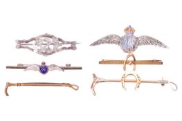 A collection of six bar brooches, comprising a bi-coloured riding crop stock pin with an applied hor