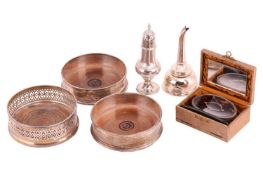 A pair of silver coasters, a pierced silver coaster, a silver pepper caster, a silver wine funnel (b