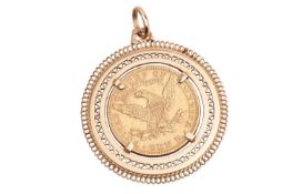 An 1890 liberty head 10 Dollar gold coin, mounted in a round yellow metal pendant stamped '750'; 26.