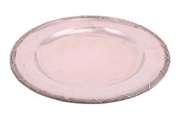 An Austro-Hungarian platter of round form, featuring a wide rim with reeded edge, measuring approxim