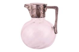 A Victorian silver-mounted claret jug designed by Christopher Dresser for Hukin & Heath, London 