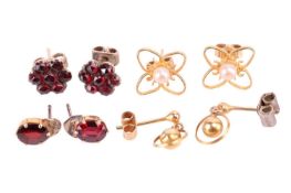 A collection of four pairs of earrings, to include a pair of garnet cluster earrings, a pair of garn