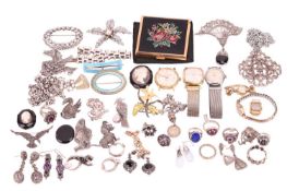 A quantity of white metal decorative jewellery. To include a group lot of four dress watches by bran