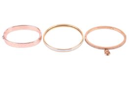 Three designer bracelets comprising a Hermes bangle in blue 