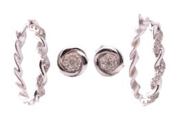 A pair of diamond-set twist hoop earrings, in 9ct white gold, together with a pair of diamond cluste