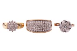A diamond-set floral cluster ring, set with seven round brilliant diamonds, in a bi-colour mount, ha