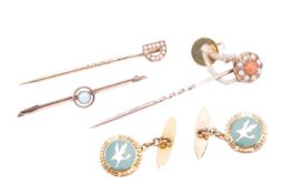 A seed pearl and coral floral stick pin in yellow metal tested as 9ct gold together with a turquoise