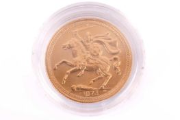 A 1973 Isle Of Man Elizabeth II Full-Sovereign with a plastic case, circulated.