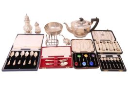 A collection of silver comprising a teapot, a silver toast rack, a sugar sifter, a pepperette, a cas