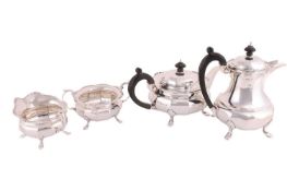 A four-piece silver tea service, by Docker & Burn Ltd., Birmingham 1922, comprising a hot pot, a
