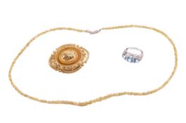A collection of jewellery, including a blue topaz and diamond ring featuring three round blue topaz 
