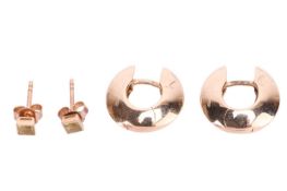 A pair of huggy earrings in 9ct yellow gold, and a pair of stud earrings set with 3.0 mm square-cut 