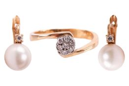 A diamond cluster ring and a pair of pearl and diamond earrings; the ring in a cross-over design wit