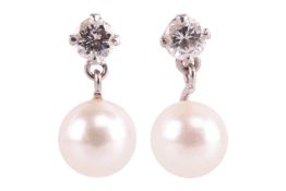 A pair of diamond and cultured pearl drop earrings, each set with a single round brilliant cut diamo