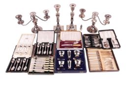 A cased silver cruet together with several cased silver and silver-plated spoons, ivorine-handled kn