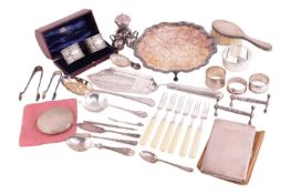 A collection of silver, including a silver salver with a shaped rim on three feet, measuring 20.5cm 