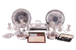 A Victorian silver salver, circular with raised scroll and foliate border and flat chasing to centre