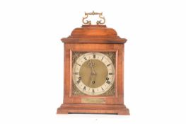 A mid-century bracket clock with a commemorative plaque, measures 41 cm tall.