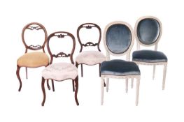 A pair of 20th-century French salon chairs, with blue plush upholstery, pin-head decoration, and pai