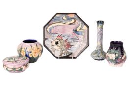 Five Moorcroft pieces comprising of a Black Ryden plate by Emma Bossons, 24cm diameter, a Snowberry 