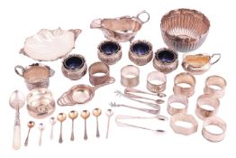 A collection of mixed silver items; to include a set of four glass-lined salt cellars with associate