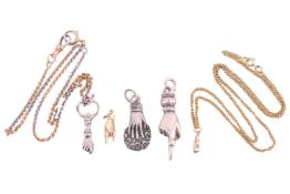 A collection of jewellery items depicting hands comprising a yellow metal clenched fist hand pendent