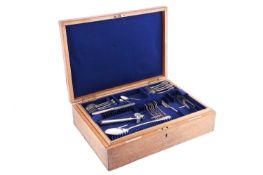 A group of mixed silver flatware and a plated bone holder in an oak canteen case; to include: 6x fid