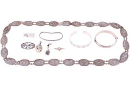 A collection of jewellery, including a hallmarked silver bangle with engraved decoration, weighing 1