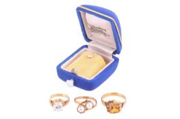 A collection of gem-set jewellery items comprising a claw-set citrine ring in yellow metal tested as