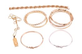 A collection of bangles, including a rope chain bracelet with Italian control marks and English impo