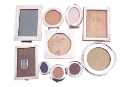 A group of ten silver fronted easel photo frames, all with English hallmarks, various dates, shapes 