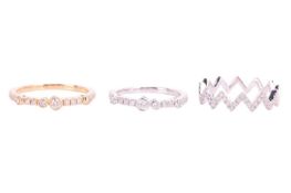 Three diamond-set 18ct gold rings comprising an 18ct white gold diamond half-eternity ring, with an 